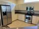 Spacious kitchen with stainless steel appliances and ample counter space at 102 Calle Del Paradiso Est, Venice, FL 34285