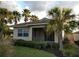 View of the covered lanai with a lush tropical view at 102 Mestre Ct, North Venice, FL 34275