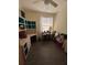 This bedroom features a custom built-in desk and storage, and wood-look flooring at 102 Mestre Ct, North Venice, FL 34275