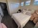 Cozy bedroom featuring neutral color palette, wood-look floors, and ample closet space at 102 Mestre Ct, North Venice, FL 34275