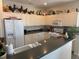 Well-maintained kitchen featuring ample cabinetry, gas range and counter seating at 102 Mestre Ct, North Venice, FL 34275