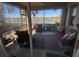 Relaxing screened lanai with comfortable seating and serene lake views at 102 Mestre Ct, North Venice, FL 34275