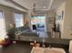 Inviting living room with view of the lanai and lake at 102 Mestre Ct, North Venice, FL 34275