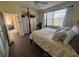 Comfortable main bedroom featuring wood look floors, and a neutral color palette at 102 Mestre Ct, North Venice, FL 34275