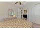 Comfortable bedroom features a ceiling fan and a mirrored vanity at 11810 Tapestry Ln, Venice, FL 34293