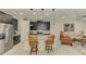 Well-equipped kitchen with an island, stainless steel appliances, and bar stool seating at 11810 Tapestry Ln, Venice, FL 34293