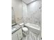 Bathroom features white marble-look shower and floors, granite counters, a perfect blend of style and function at 12316 Durango Ave, North Port, FL 34287