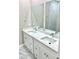 Double vanity in bathroom featuring marble countertops and dual sinks at 12316 Durango Ave, North Port, FL 34287