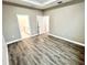 Large bedroom with wood floors showing bathroom and walk-in closet entries at 12316 Durango Ave, North Port, FL 34287