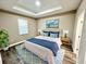 Comfortable bedroom with tray ceiling, wood floors and decorative coastal accents at 12316 Durango Ave, North Port, FL 34287
