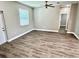 Bright bedroom with modern flooring, a ceiling fan, and a doorway to another room at 12316 Durango Ave, North Port, FL 34287