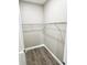 Walk-in closet with closet rod and wood flooring at 12316 Durango Ave, North Port, FL 34287