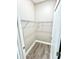 A closet featuring a wire shelf and wood-look floors, showcasing the storage space in the house at 12316 Durango Ave, North Port, FL 34287