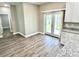 Dining area with sliding glass doors to the backyard and modern cabinets and countertops at 12316 Durango Ave, North Port, FL 34287