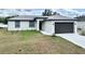 New construction single-story home featuring a two-car garage and modern design at 12316 Durango Ave, North Port, FL 34287