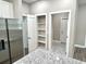 Bright kitchen featuring granite counters, stainless fridge, and a convenient pantry at 12316 Durango Ave, North Port, FL 34287