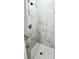 Walk-in shower featuring decorative tile surround and mosaic tile floor at 12316 Durango Ave, North Port, FL 34287