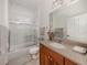 Well-lit bathroom with a shower-tub combo, single vanity, and neutral finishes at 129 Cipriani Way, North Venice, FL 34275