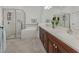 Elegant bathroom with a soaking tub, walk-in shower, dual sinks, and stylish fixtures at 129 Cipriani Way, North Venice, FL 34275