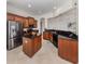 Well-equipped kitchen features stainless steel appliances, granite countertops, and ample cabinet space at 129 Cipriani Way, North Venice, FL 34275