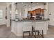 Kitchen bar with pendant lights, offering extra seating and a perfect spot for casual dining at 129 Cipriani Way, North Venice, FL 34275