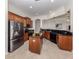 Well-equipped kitchen features stainless steel appliances, granite countertops, and ample cabinet space at 129 Cipriani Way, North Venice, FL 34275