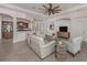 Cozy living room connected to the kitchen featuring neutral paint, tile floors, and lots of natural light at 129 Cipriani Way, North Venice, FL 34275