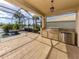 Outdoor kitchen equipped with a stainless steel grill and prep area, perfect for outdoor entertaining by the pool at 129 Cipriani Way, North Venice, FL 34275