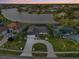 Stunning aerial view of a single-Gathering home with mature landscaping and serene waterfront views at 1300 Lucaya Ave, Venice, FL 34285