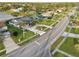 Residential street featuring well-maintained homes with mature trees and green lawns at 1300 Lucaya Ave, Venice, FL 34285