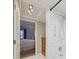 Bathroom featuring tiled shower and view into the bedroom with chest of drawers at 1300 Lucaya Ave, Venice, FL 34285