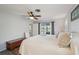 Bedroom featuring wood-look floors, ceiling fan, and peaceful view of the outdoors at 1300 Lucaya Ave, Venice, FL 34285