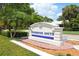 Pinebrook South community sign with lush landscaping and clear blue skies at 1300 Lucaya Ave, Venice, FL 34285