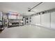 Large garage featuring built-in storage, washer, dryer, and epoxy flooring at 1300 Lucaya Ave, Venice, FL 34285