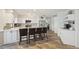 Large modern kitchen with a long island and barstools, stainless appliances and open layout at 1300 Lucaya Ave, Venice, FL 34285