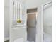 Bright bathroom featuring a glass shower and decorative shelf with floral accents at 1330 Berkshire Ct, Venice, FL 34292
