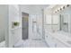 Light and bright bathroom with shower and double vanity at 1330 Berkshire Ct, Venice, FL 34292