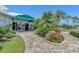 Waterford Sports Club entrance featuring well-maintained landscaping and a welcoming pathway at 1330 Berkshire Ct, Venice, FL 34292