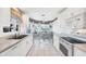Eat-in kitchen with white cabinetry and lots of natural light at 1330 Berkshire Ct, Venice, FL 34292