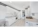 Galley kitchen with white cabinetry and stainless appliances at 1330 Berkshire Ct, Venice, FL 34292