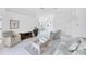 Large living area with vaulted ceilings and a coffee table between the sofa and chairs at 1330 Berkshire Ct, Venice, FL 34292
