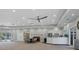 Large meeting room featuring a kitchen area, tables, and plenty of lighting at 1330 Berkshire Ct, Venice, FL 34292