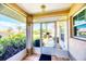 Enclosed porch featuring an decorative security door and tile floor at 1330 Berkshire Ct, Venice, FL 34292