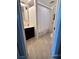 Clean bathroom with light tiled floors, white walls, and shower/tub with curtain at 1401 S Mccall Rd # 106, Englewood, FL 34223