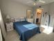 Comfortable bedroom featuring a queen bed, neutral walls, and ensuite bathroom at 1401 S Mccall Rd # 106, Englewood, FL 34223