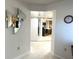 Bright entryway featuring fish wall decor that leads to kitchen with appliances and eat-in breakfast counter at 1401 S Mccall Rd # 106, Englewood, FL 34223