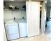 A conveniently located laundry area with full-sized washer and dryer units, along with ample storage space at 1401 S Mccall Rd # 106, Englewood, FL 34223