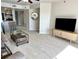 Bright living room with tile floors and open floor plan at 1401 S Mccall Rd # 106, Englewood, FL 34223