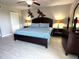 Spacious main bedroom featuring wood furnishings and decor at 1401 S Mccall Rd # 106, Englewood, FL 34223