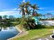 Picturesque pond with lush landscaping, offering a serene and relaxing environment at 1401 S Mccall Rd # 106, Englewood, FL 34223